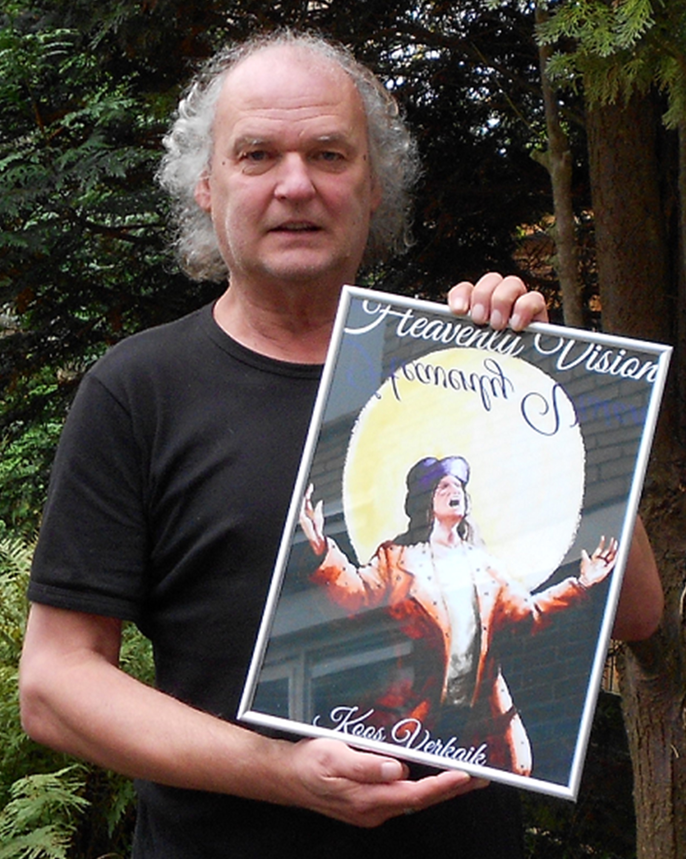 Koos Verkaik holding the cover of Heavenly Vision