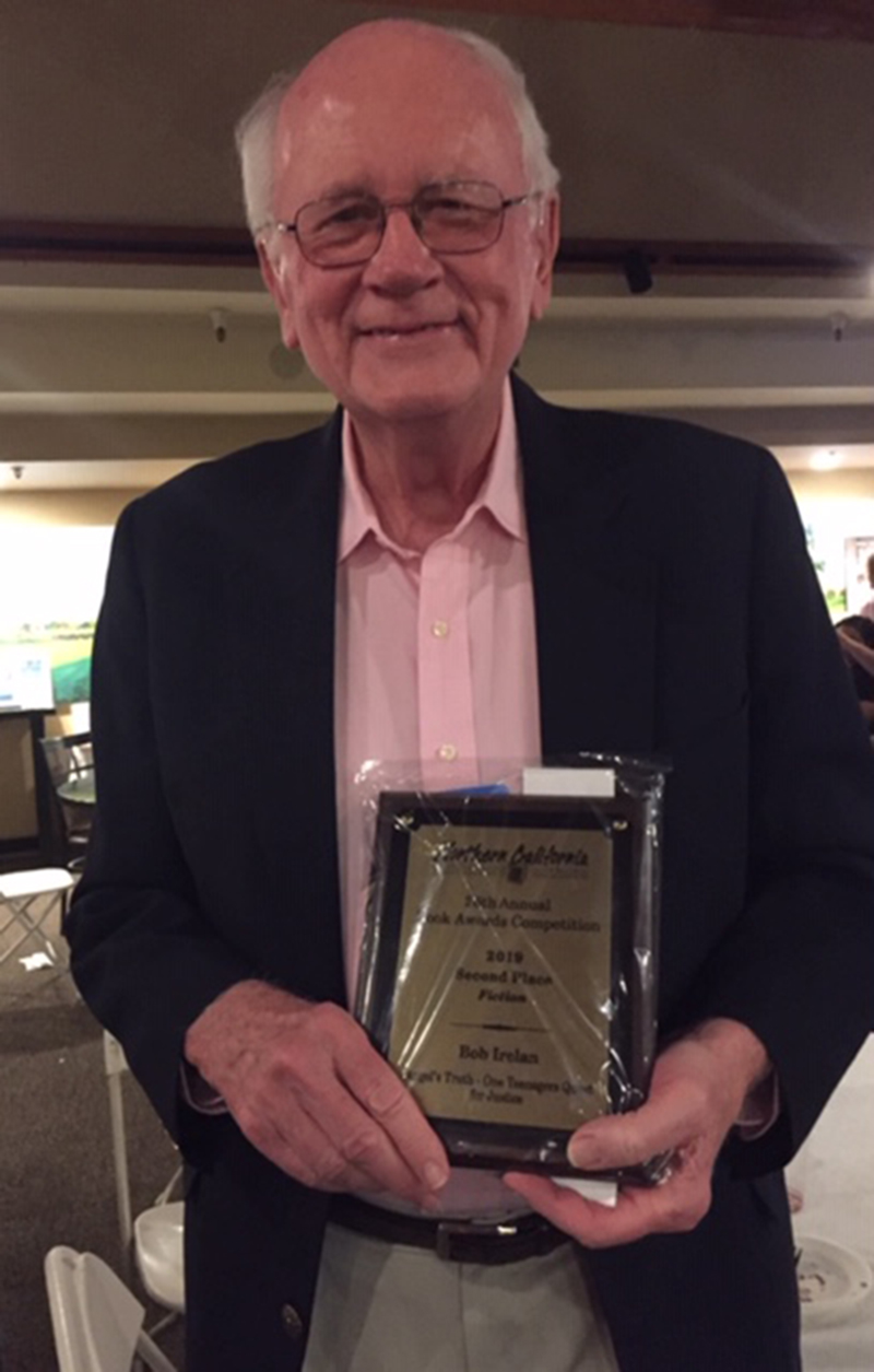 Author Bob Irelan holding his second place book award